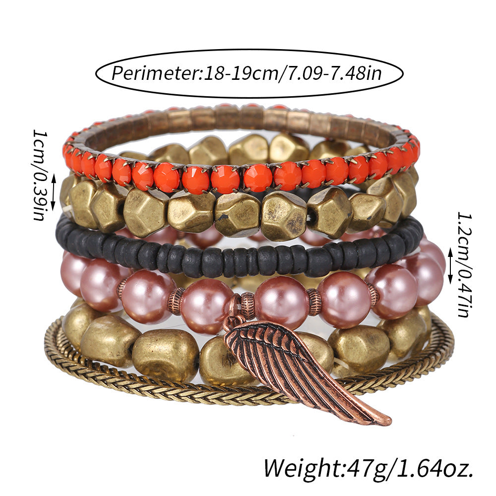 Vintage alloy wing pendant multi-layer bracelet cross-border European and American geometric metal pearl bohemian bracelet set