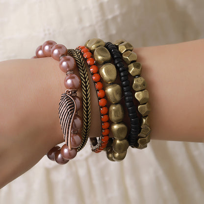 Vintage alloy wing pendant multi-layer bracelet cross-border European and American geometric metal pearl bohemian bracelet set