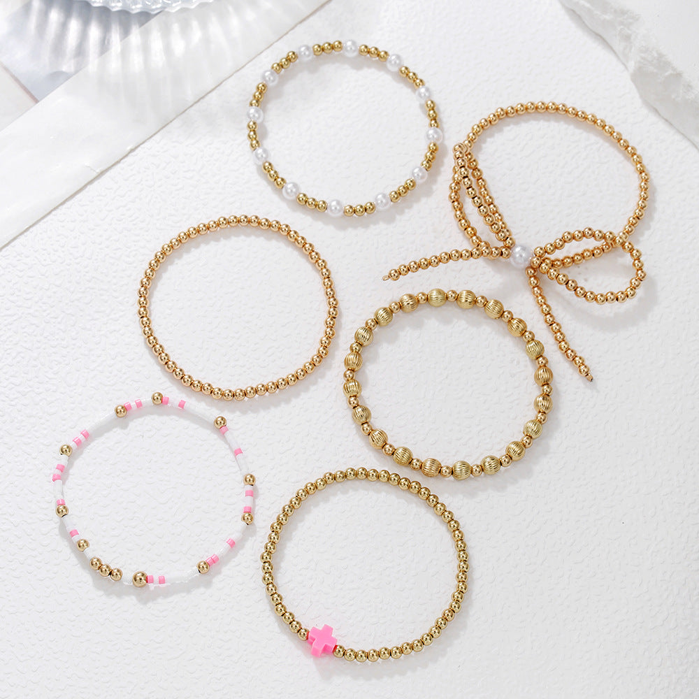 European and American cross-border hand jewelry personalized bow beaded cross multi-layer bracelet INS style imitation pearl bracelet women