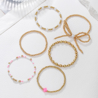 European and American cross-border hand jewelry personalized bow beaded cross multi-layer bracelet INS style imitation pearl bracelet women