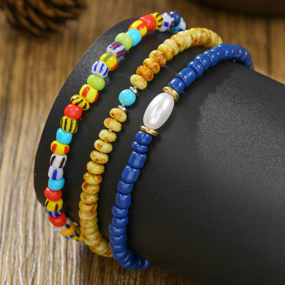 Bohemian vacation style elastic rice bead bracelet ins design sense niche contrasting colors stacked pearl men's bracelet