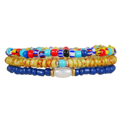 Bohemian vacation style elastic rice bead bracelet ins design sense niche contrasting colors stacked pearl men's bracelet
