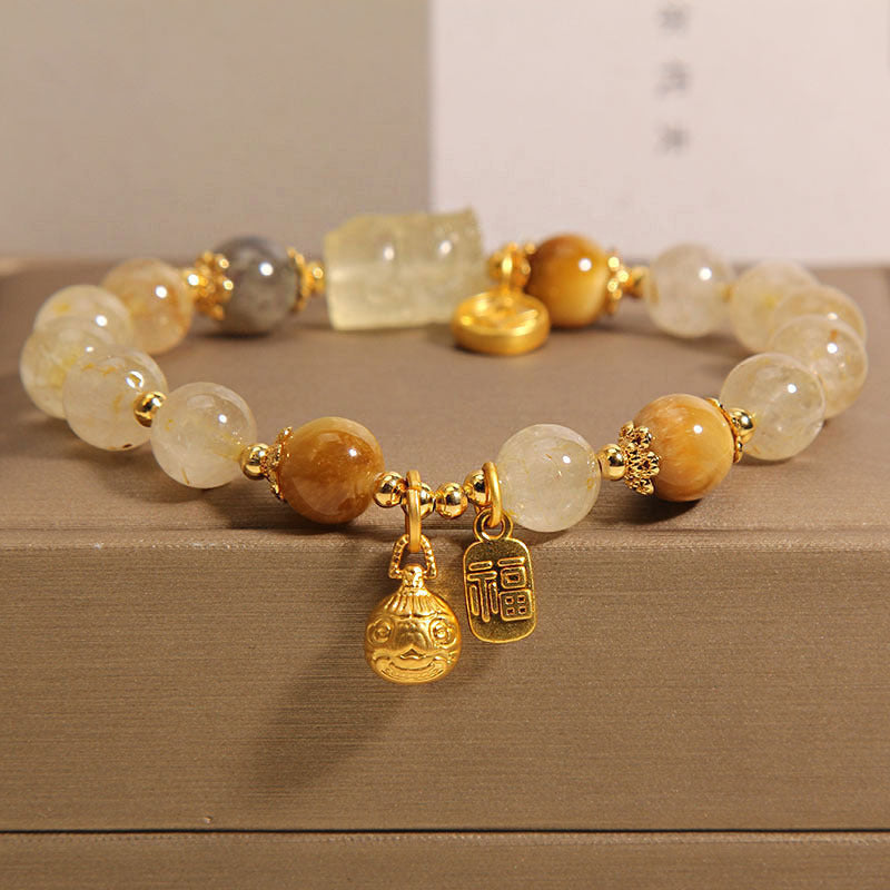 Natural golden crystal moonstone bracelet, female gold swallowing beast yellow tiger eye stone yellow hair crystal bracelet for girlfriend and girlfriend.