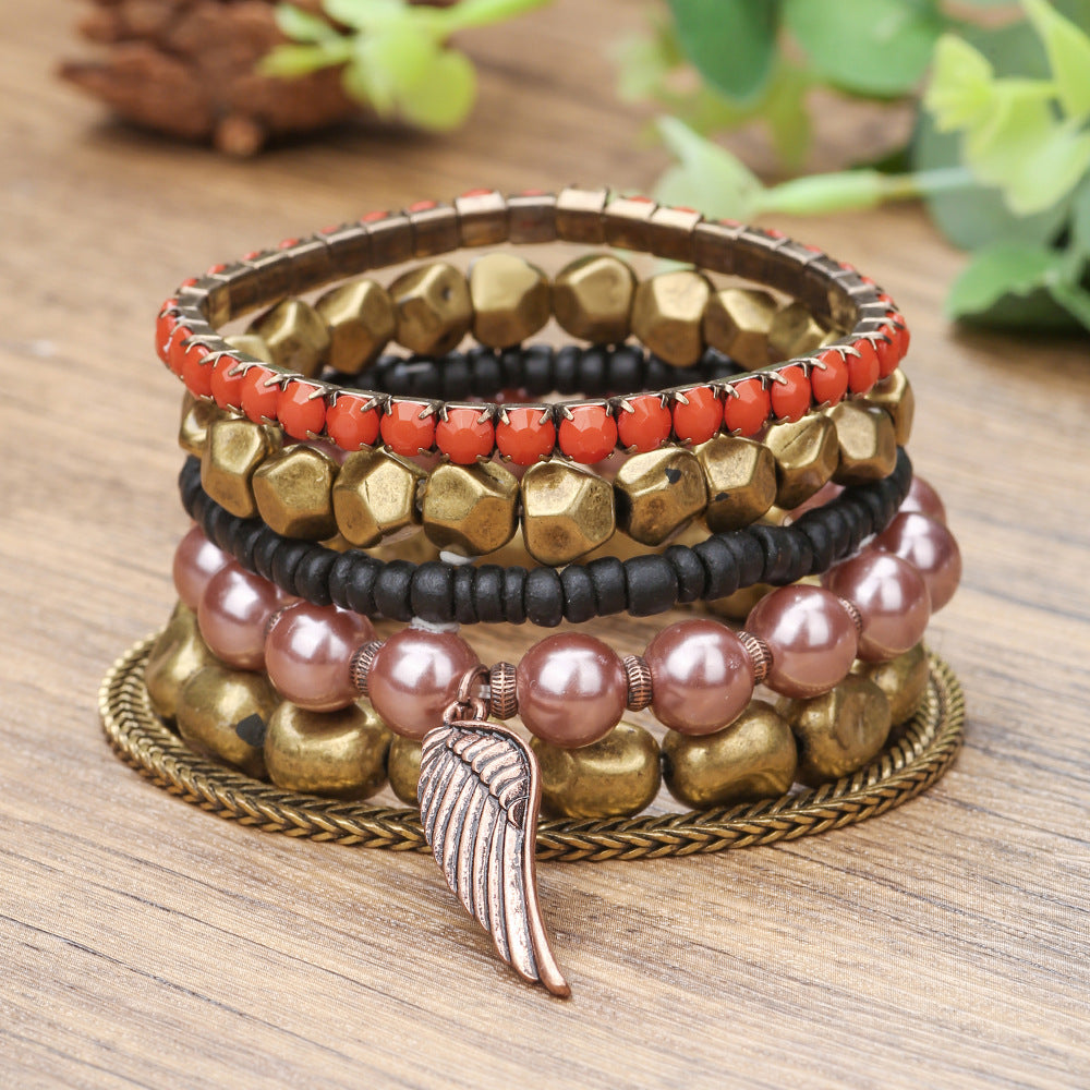 Vintage alloy wing pendant multi-layer bracelet cross-border European and American geometric metal pearl bohemian bracelet set