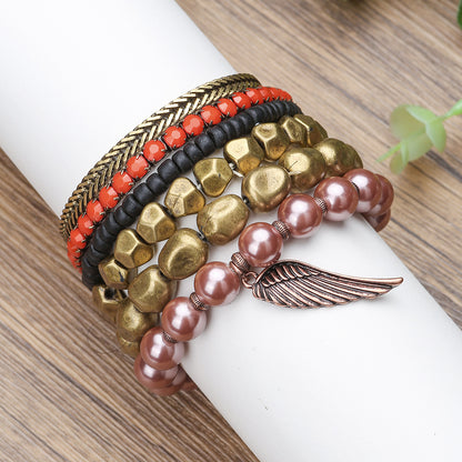 Vintage alloy wing pendant multi-layer bracelet cross-border European and American geometric metal pearl bohemian bracelet set