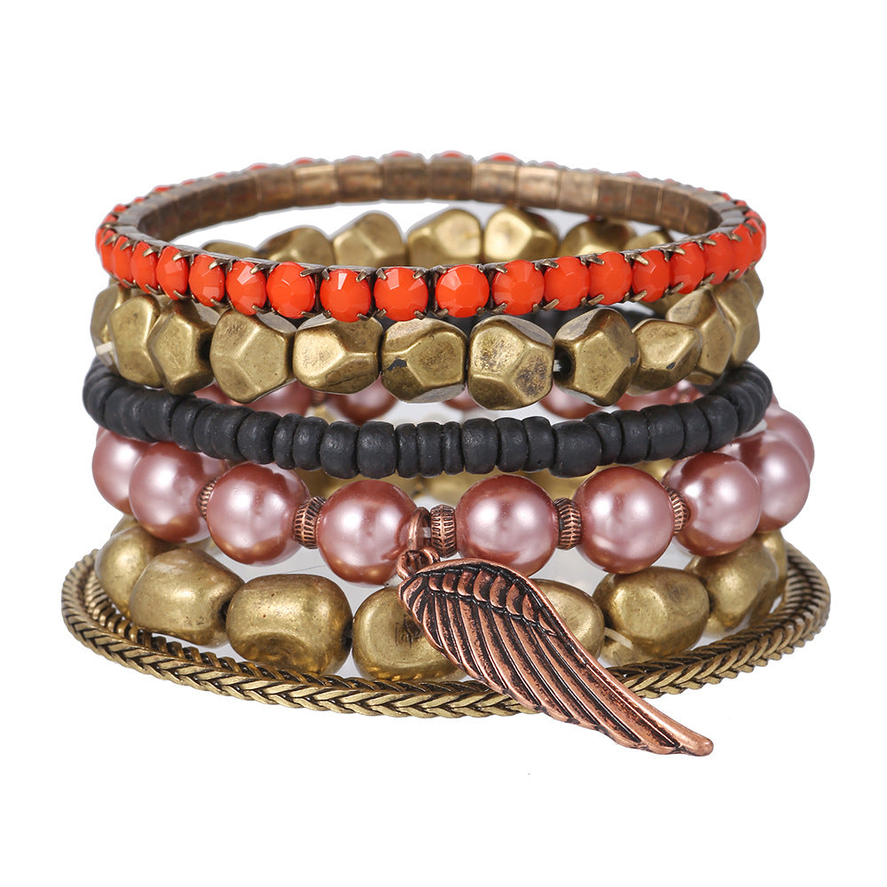 Vintage alloy wing pendant multi-layer bracelet cross-border European and American geometric metal pearl bohemian bracelet set